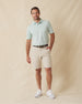 Men’s Sullivan Polo in celery green worn with khaki shorts, full-body view