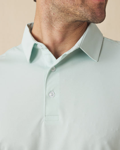 Close-up of the Sullivan Polo collar and placket in celery green