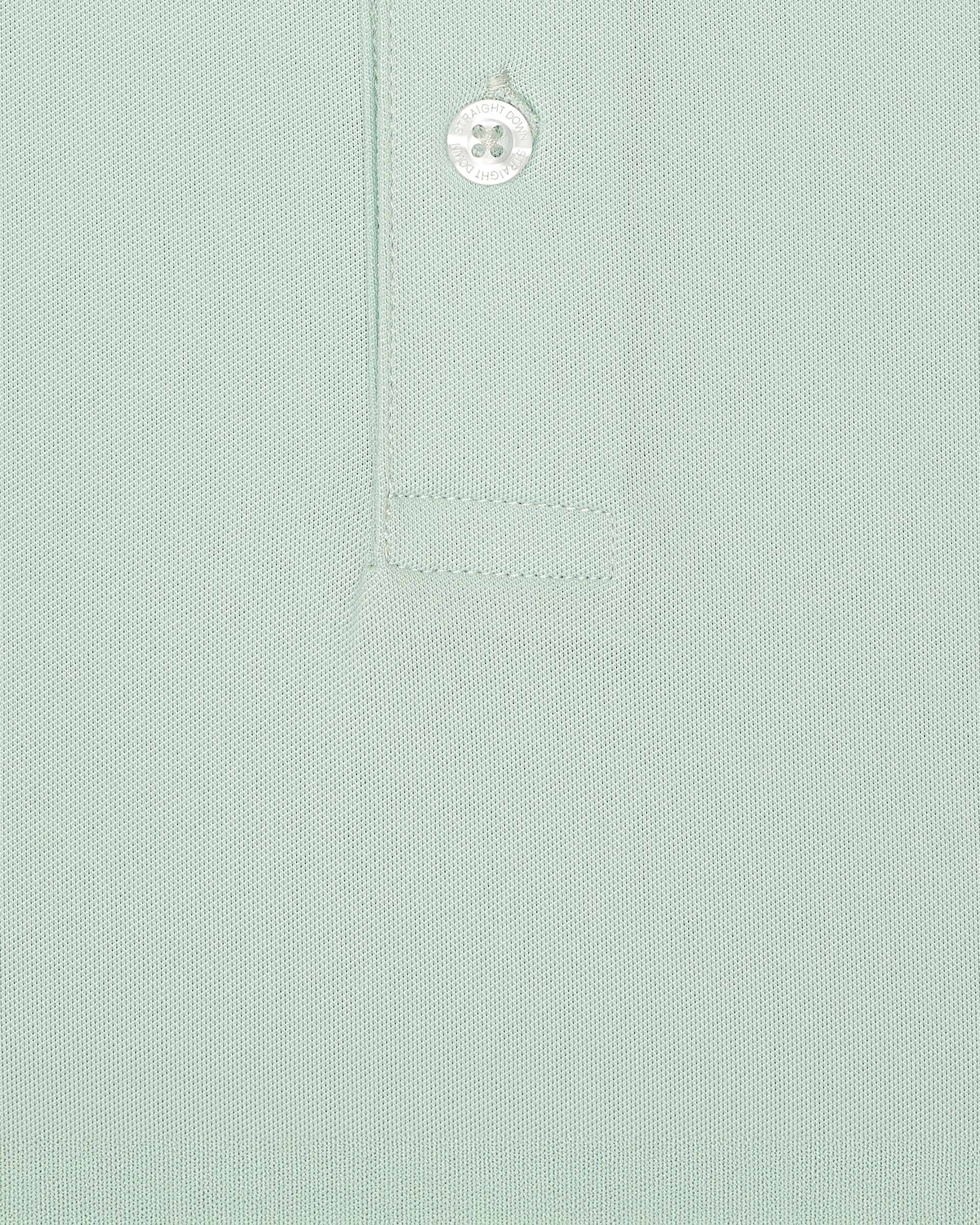 Close-up fabric texture detail of the Sullivan Polo in celery green