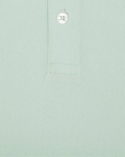 Close-up fabric texture detail of the Sullivan Polo in celery green