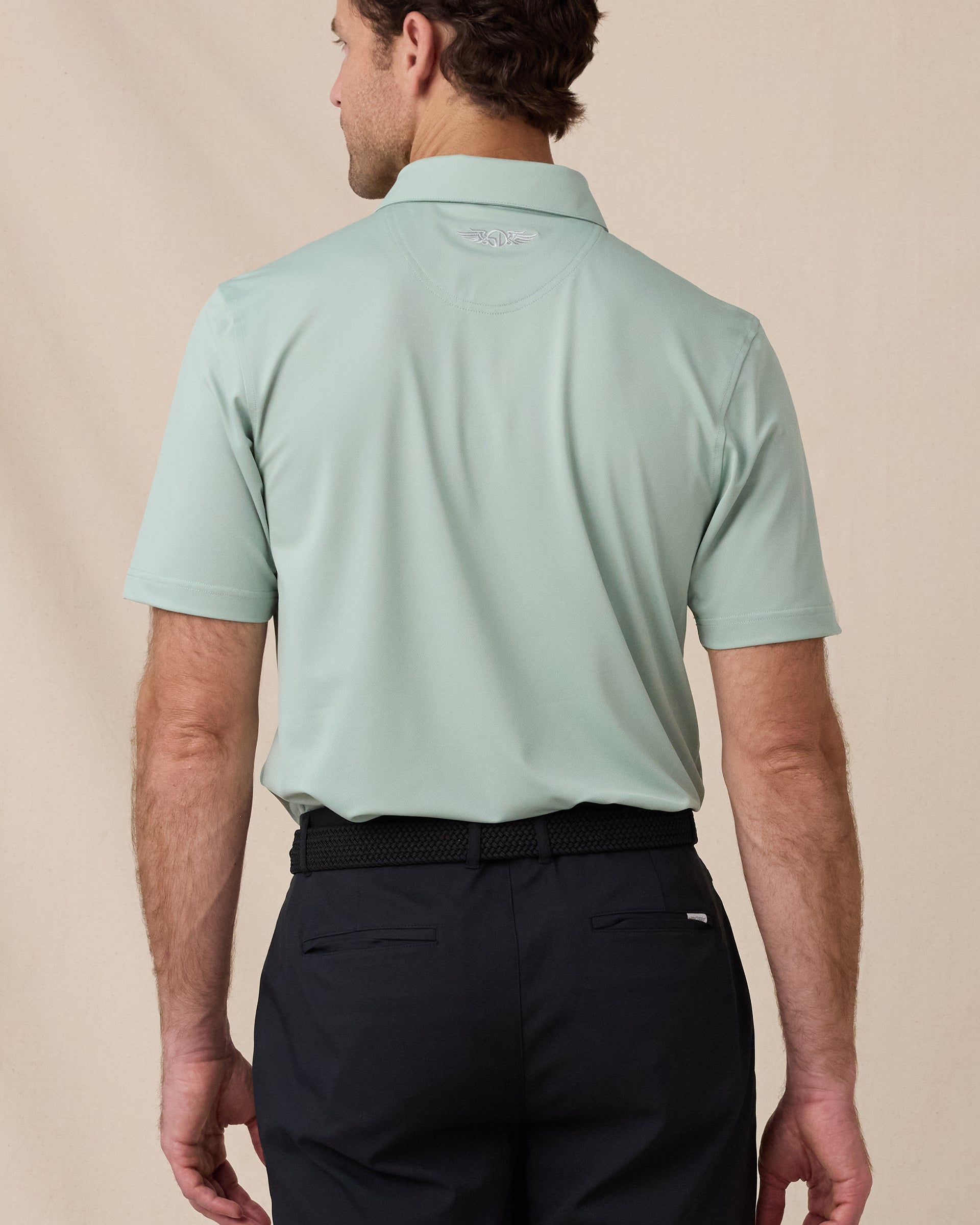 Sullivan Polo in Herb Green, back view with embroidered logo detail