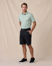 Sullivan Polo in Herb Green with black golf pants, full outfit model view
