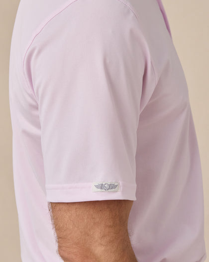 Sleeve detail of the Sullivan Polo in Lilac showing the smooth performance fabric and signature Straight Down logo tab at the cuff