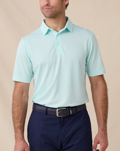 Sullivan Polo in Mint Tea worn with navy golf shorts, front model view