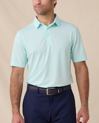 Sullivan Polo in Mint Tea worn with navy golf shorts, front model view