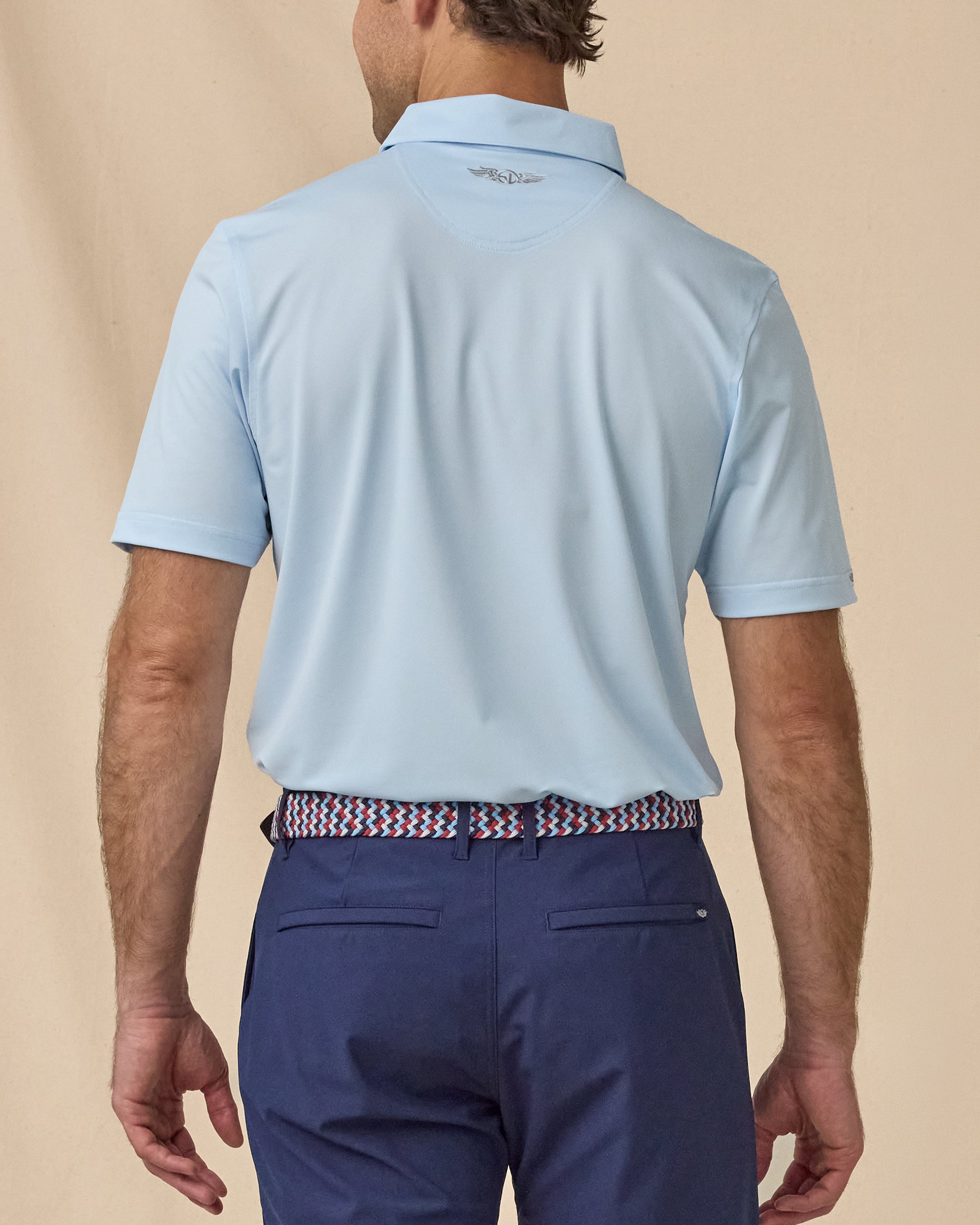 Sullivan Polo in Nantucket blue, back view paired with navy shorts