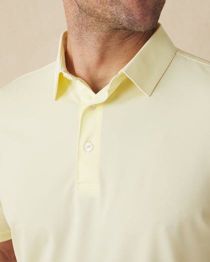 Close-up of the Sullivan Polo collar and placket in pale yellow