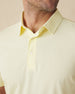 Close-up of the Sullivan Polo collar and placket in pale yellow