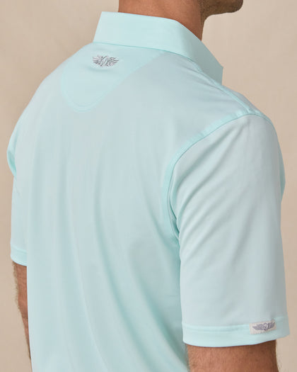 Sullivan Polo in Mint Tea with embroidered back neck logo, close-up view