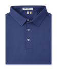 Folded men’s blue performance polo with classic collar and button placket