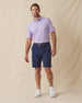 Men’s Sullivan Polo in violet worn with navy shorts, full-body view