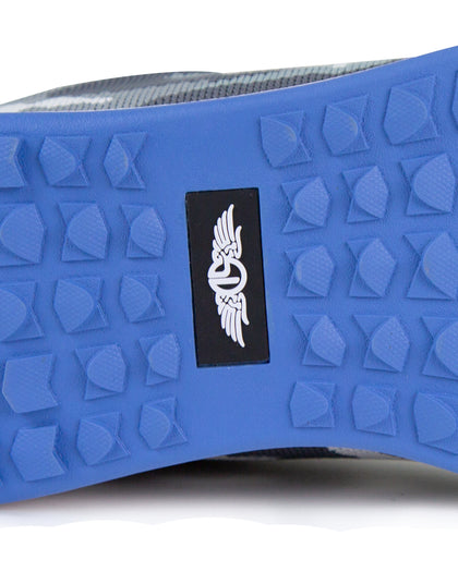 Men's Field V2 Shoe in Camo Carbon, close-up outsole detail view featuring the blue traction outsole and black SD logo label