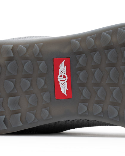 Men's Field V2 Shoe in Carbon, close-up outsole detail view featuring the gray traction outsole and red SD logo label