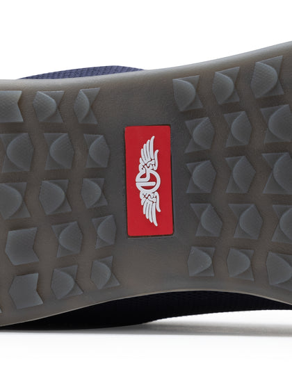 Men's Field V2 Shoe in Indigo, close-up outsole detail view featuring the gray traction outsole and red SD logo label