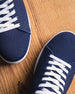 Men's Field V2 Shoe in Indigo, close-up front detail view of both shoes featuring the navy mesh knit upper and white laces
