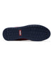 Men's Field V2 Shoe in Red, bottom sole view featuring a navy rubber outsole with multi-directional traction lugs and a branded logo badge