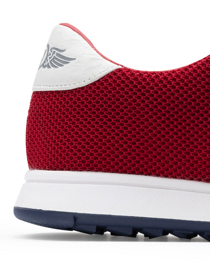 Men's Field V2 Shoe in Red, close-up heel view featuring a red breathable mesh upper with a white leather heel collar and embossed wing logo detail