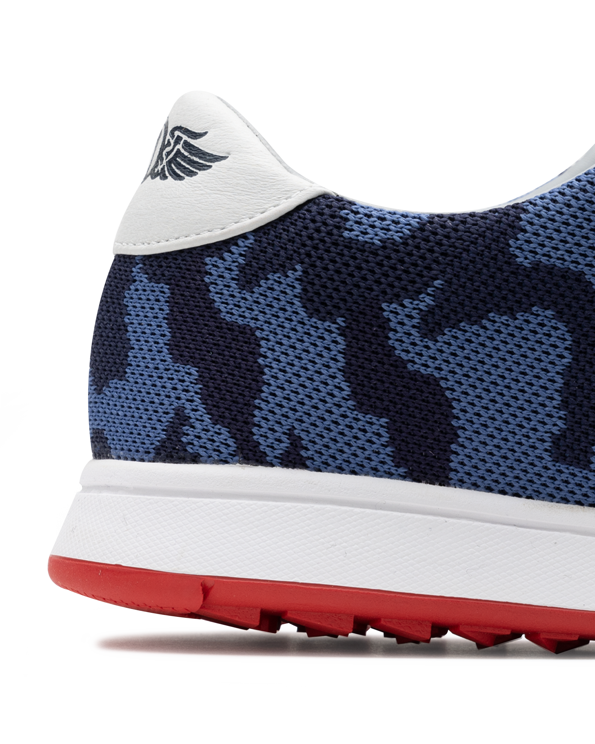 Men's Field V2 Shoe in Camo Indigo, close-up heel view featuring a navy and blue camo print breathable mesh upper with a white leather heel collar and embossed wing logo detail