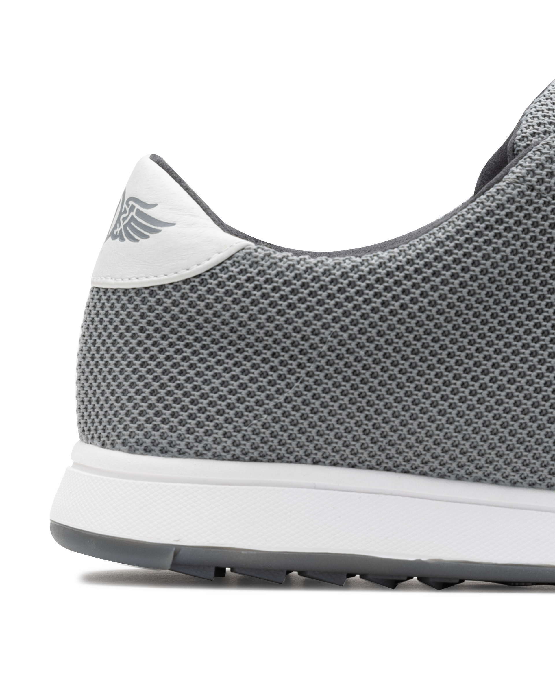 Men's Field V2 Shoe in Carbon, close-up heel detail view featuring the gray mesh knit upper, white heel tab with SD wing logo, and white midsole