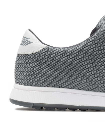 Men's Field V2 Shoe in Carbon, close-up heel detail view featuring the gray mesh knit upper, white heel tab with SD wing logo, and white midsole