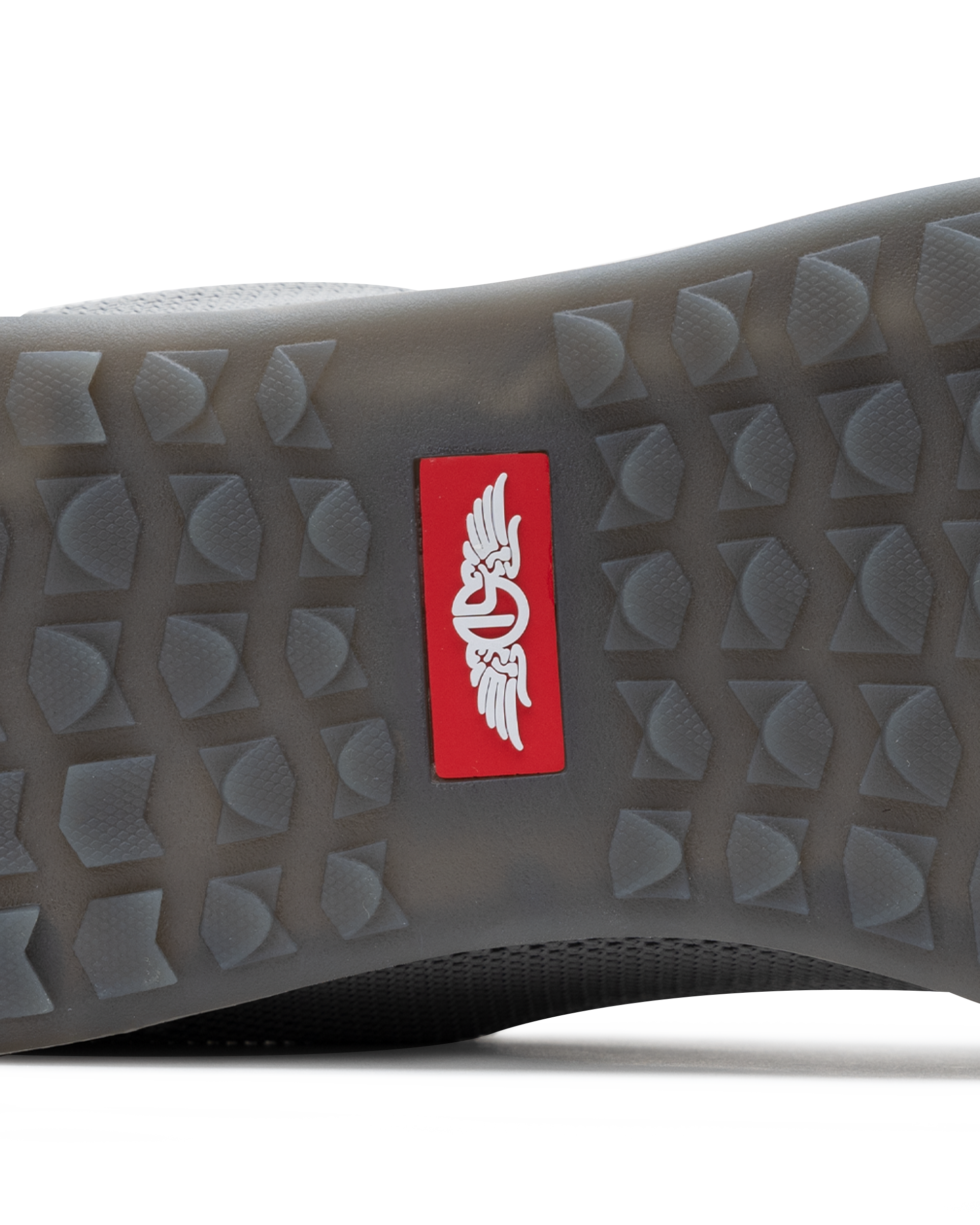 Men's Field V2 Shoe in Carbon, close-up outsole detail view featuring the gray traction outsole and red SD logo label