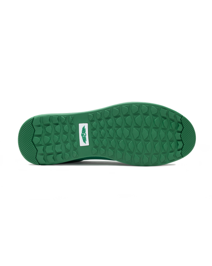 Men's Field V2 Shoe in Green, bottom sole view featuring a green rubber outsole with multi-directional traction lugs and a white branded logo badge