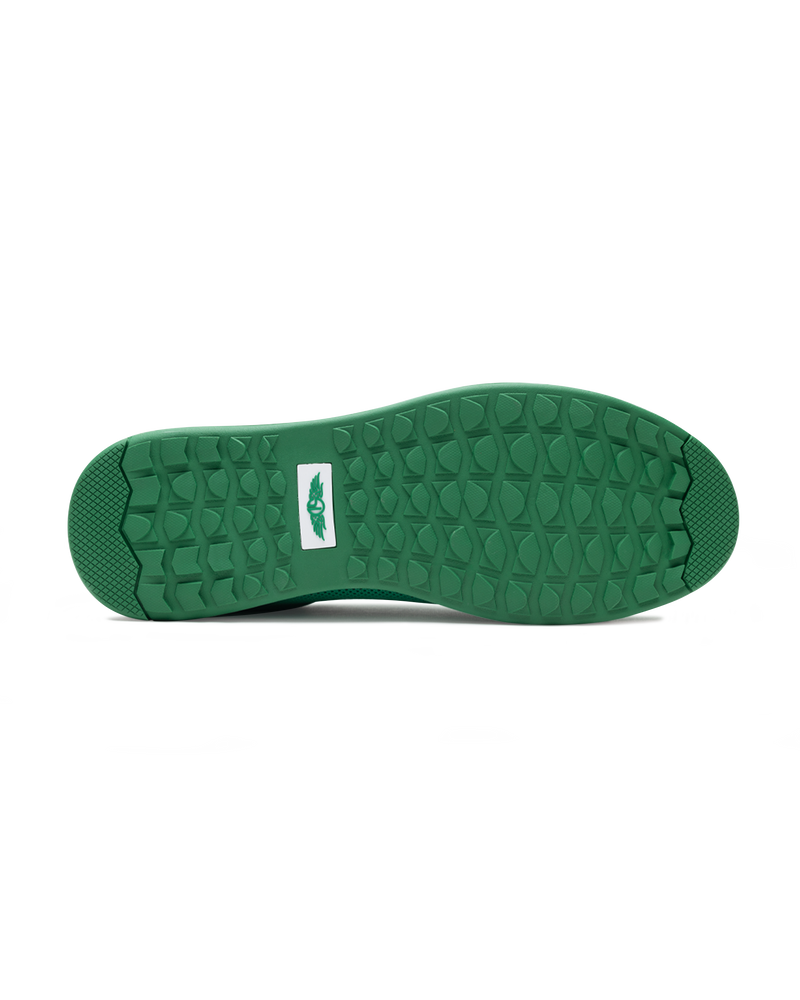Men's Field V2 Shoe in Green, bottom sole view featuring a green rubber outsole with multi-directional traction lugs and a white branded logo badge