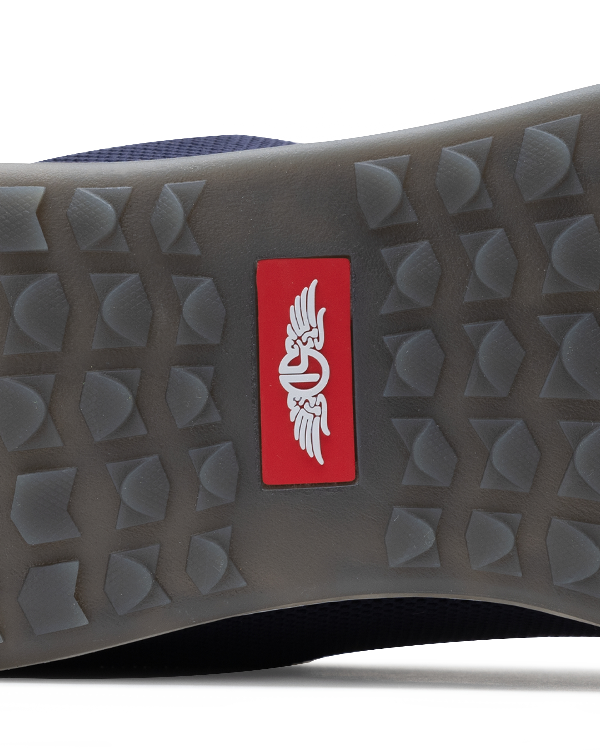 Men's Field V2 Shoe in Indigo, close-up outsole detail view featuring the gray traction outsole and red SD logo label