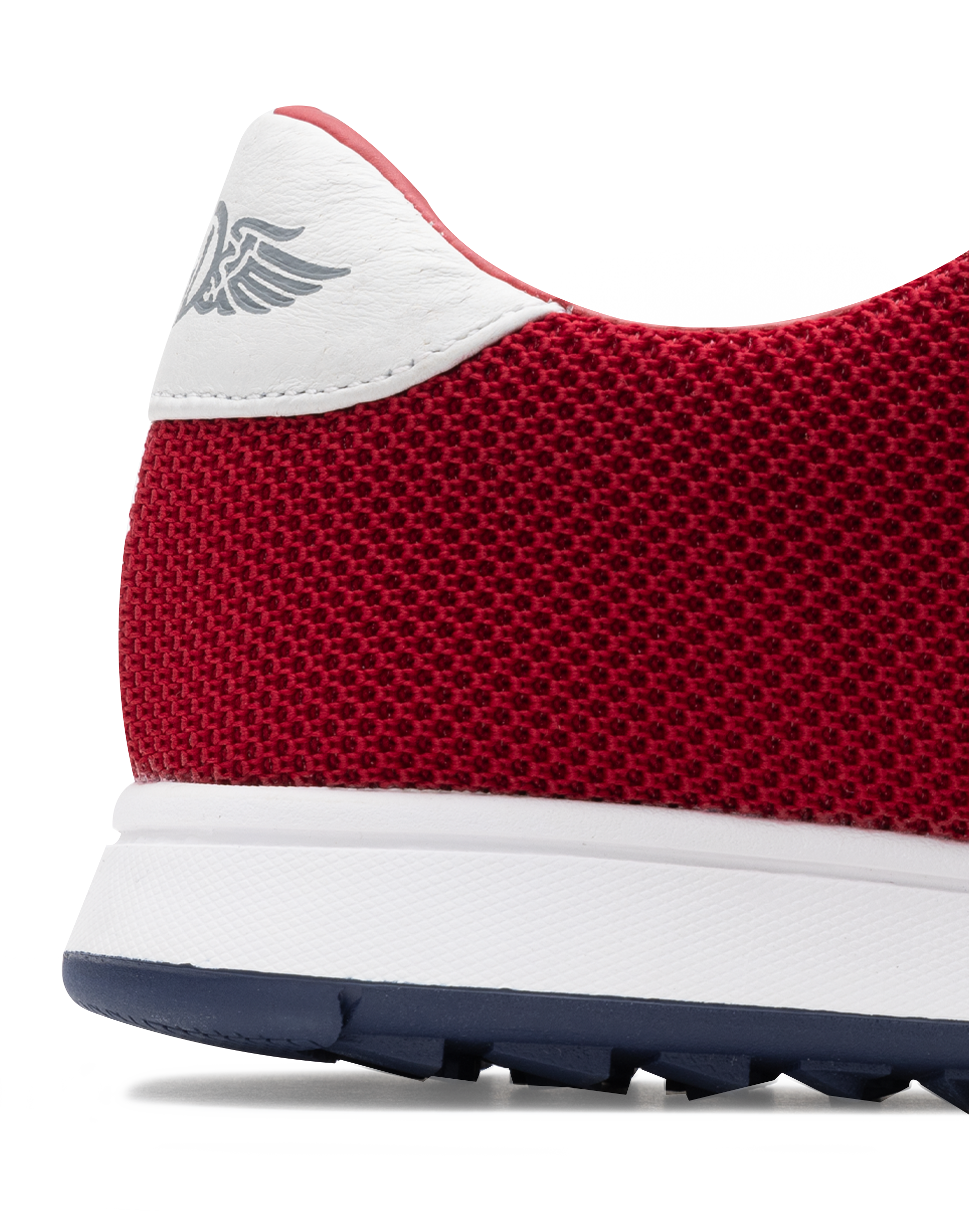 Men's Field V2 Shoe in Red, close-up heel view featuring a red breathable mesh upper with a white leather heel collar and embossed wing logo detail
