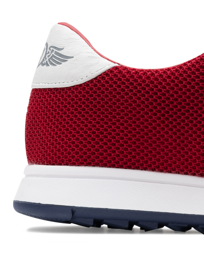 Men's Field V2 Shoe in Red, close-up heel view featuring a red breathable mesh upper with a white leather heel collar and embossed wing logo detail