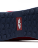 Men's Field V2 Shoe in Red, close-up outsole view featuring a navy rubber outsole with multi-directional traction outsole and a red branded logo badge