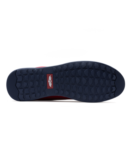 Men's Field V2 Shoe in Red, bottom sole view featuring a navy rubber outsole with multi-directional traction lugs and a branded logo badge