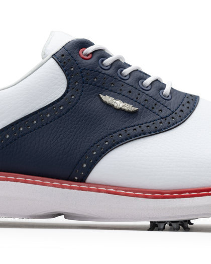 Men's Victory Classic Shoe in Red White Blue, close-up side detail view featuring the navy saddle overlay, brogue perforated detailing, red lace eyelet accent, and metal SD wing logo
