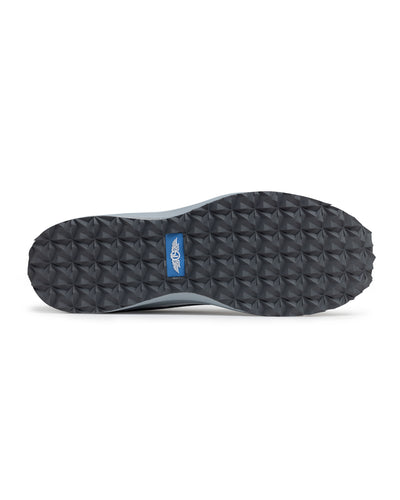 Straight Down Mojave Shoe in Camo Carbon, bottom view featuring a dark grey geometric textured outsole with Straight Down logo tab in blue