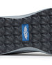 Straight Down Mojave Shoe in Camo Carbon, close-up bottom view of the dark grey geometric textured outsole with Straight Down logo tab in blue