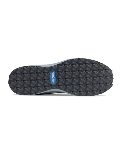 Straight Down Mojave Shoe in Camo Carbon, bottom view featuring a dark grey geometric textured outsole with Straight Down logo tab in blue
