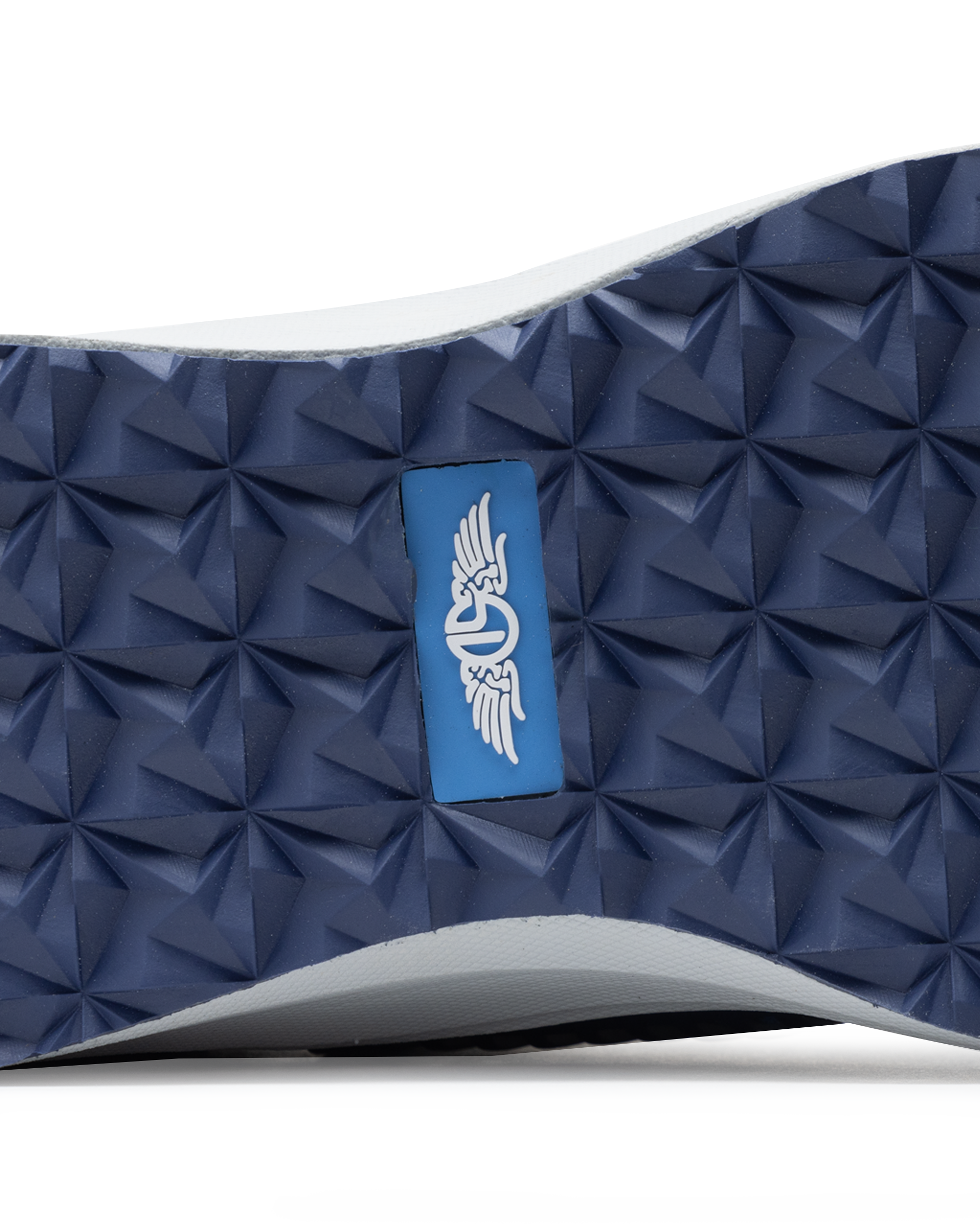 Straight Down Women's Moonlight Shoe in Scuba, close-up bottom view featuring navy traction outsole with geometric grip pattern and blue Straight Down logo badge