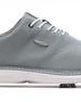 A close-up side view of a light gray knit golf shoe with white laces, a white sole, and a small silver wing logo on the side.