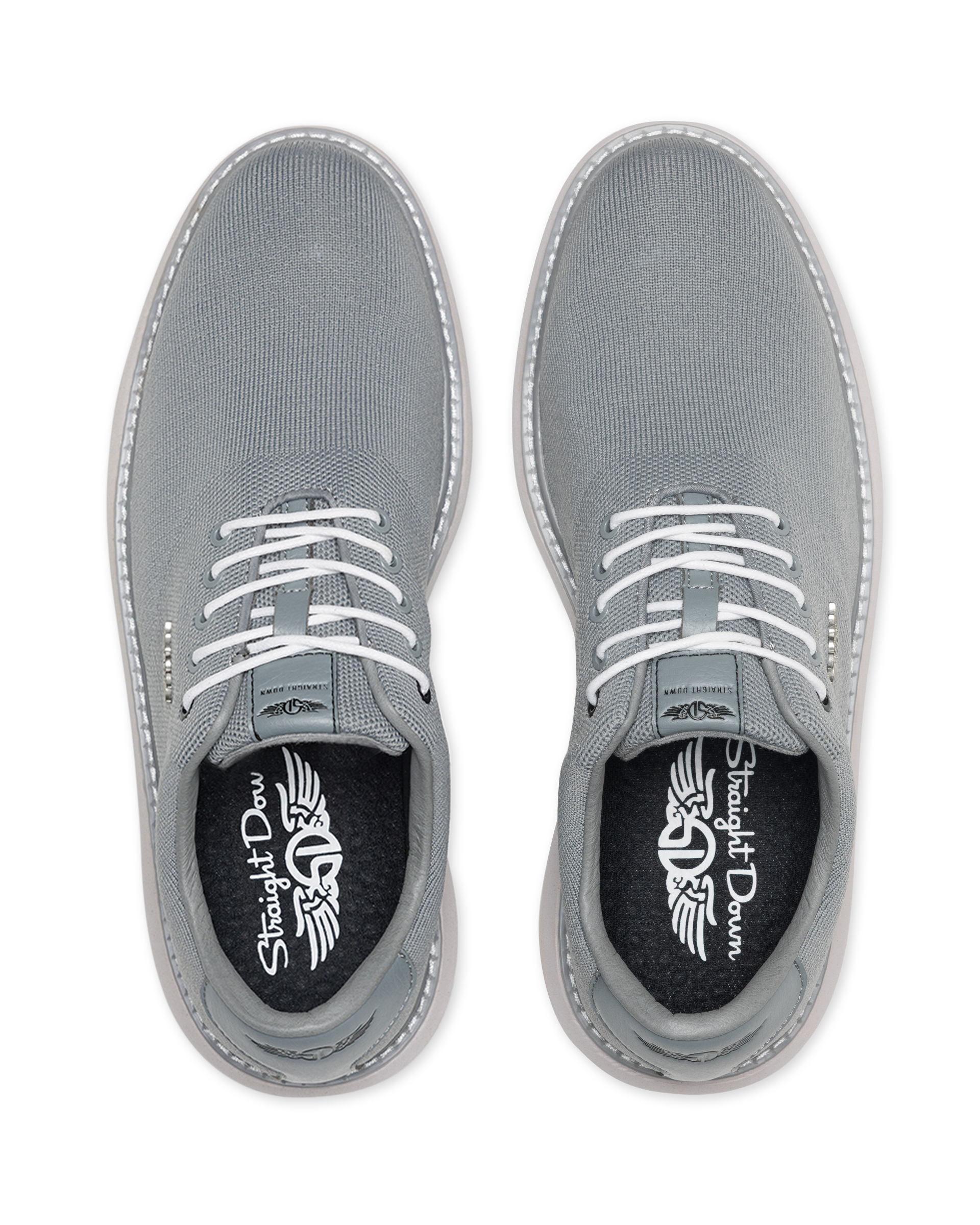 A pair of gray canvas lace-up shoes shown from a top-down view on a white background, featuring white laces and a black insole with the Straight Downs logo.