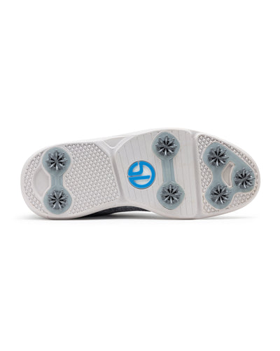 Men's Challenger Shoe in Carbon, bottom sole view featuring a white rubber outsole with gray spike cleats, textured traction zones, and a blue and white branded logo badge