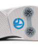 Men's Challenger Shoe in Carbon, close-up outsole view featuring a white rubber outsole with gray spike cleats and a blue branded logo badge detail