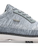 Men's Challenger Shoe in Carbon, close-up side view featuring a heathered gray knit upper highlighting the silver wing logo badge, gray leather lace stay, and black welt stitch detail with white midsole and spiked outsole