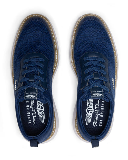 Men's Challenger Shoe in Indigo, top down view featuring a navy knit upper with navy laces, tan welt stitch detail, and a branded insole