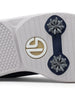 Men's Challenger Shoe in Indigo, close-up outsole view featuring a white rubber outsole with navy spike cleats and a gold and white branded logo badge detail