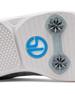 Men's Challenger Shoe in Carbon, close-up outsole view featuring a white rubber outsole with gray spike cleats and a blue branded logo badge detail