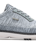 Men's Challenger Shoe in Carbon, close-up side view featuring a heathered gray knit upper highlighting the silver wing logo badge, gray leather lace stay, and black welt stitch detail with white midsole and spiked outsole