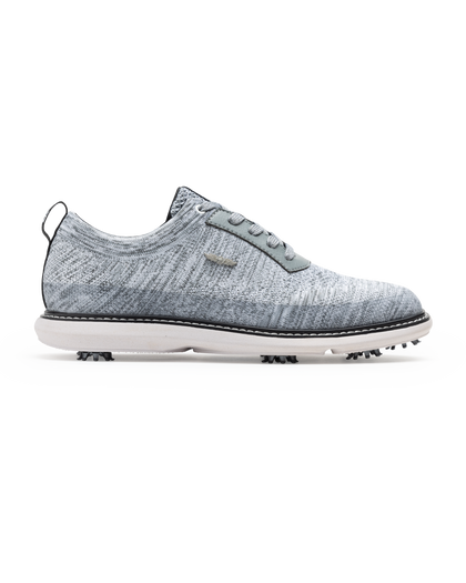 Men's Challenger Shoe in Carbon, side profile view featuring a heathered gray knit upper with gray laces, a silver wing logo badge, gray leather trim, a black welt stitch detail, white midsole, and spiked outsole