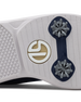 Men's Challenger Shoe in Indigo, close-up outsole view featuring a white rubber outsole with navy spike cleats and a gold and white branded logo badge detail