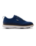 Men's Challenger Shoe in Indigo, side profile view featuring a navy knit upper with navy laces, a silver wing logo badge, navy leather trim, a tan welt stitch detail, white midsole, and spiked outsole