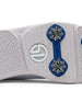 Men's Derby Shoe in White, close-up bottom view featuring a white rubber outsole with royal blue spike mounts, silver replaceable cleats, and a centered white Straight Down logo badge